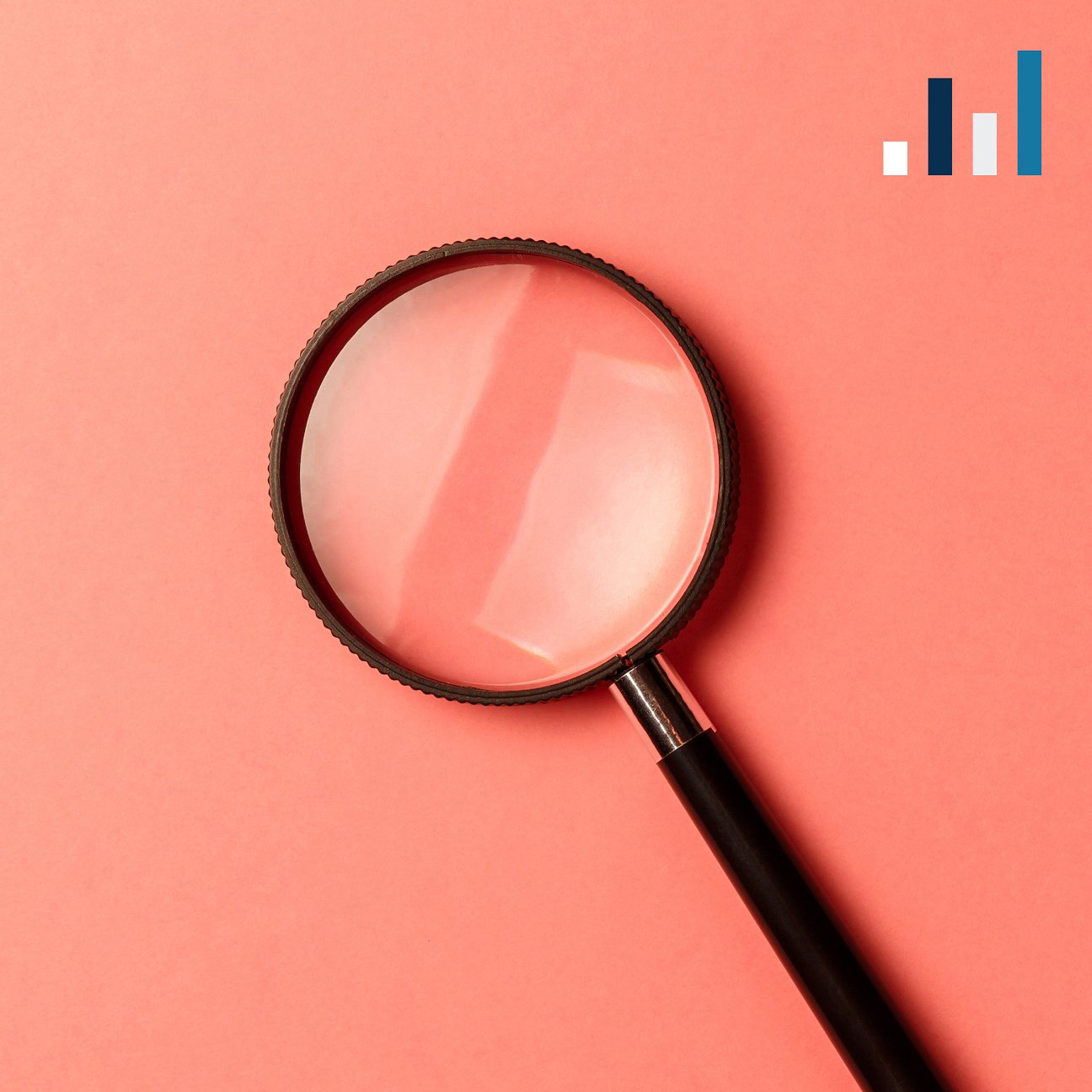 A magnifying glass positioned over a vibrant pink background, highlighting the theme of discovery and attention to detail.